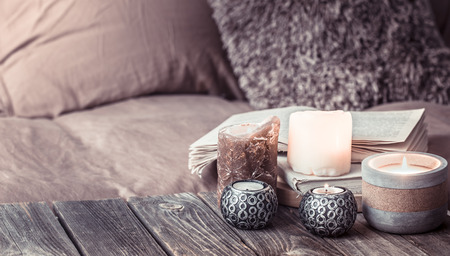 Still life cozy home, interior details in the living room on a wooden table, the concept of home comfort and careの写真素材