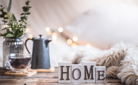home atmosphere in the interior with wooden letters and home decor items, comfort conceptの写真素材