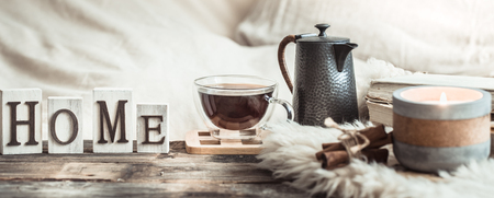 home atmosphere in the interior with wooden letters and home decor items, comfort conceptの写真素材