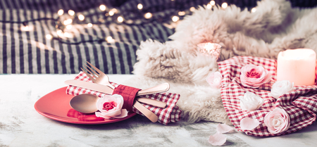 Valentine's Day, festive dinner on a wooden background cutlery in a cozy homely atmosphereの写真素材