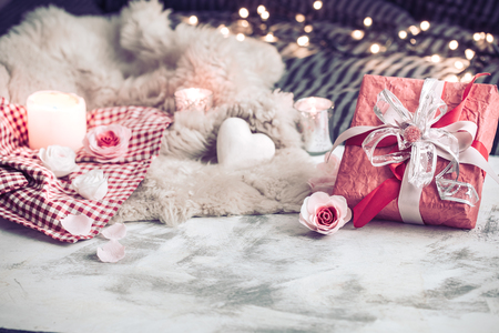 Valentine's Day, a gift on a wooden background in a homely atmosphere, the concept of holiday and friendshipsの写真素材