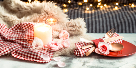 Valentine's Day, festive dinner on a wooden background cutlery in a cozy homely atmosphereの写真素材