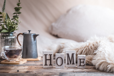 home atmosphere in the interior with wooden letters and home decor items, comfort conceptの写真素材