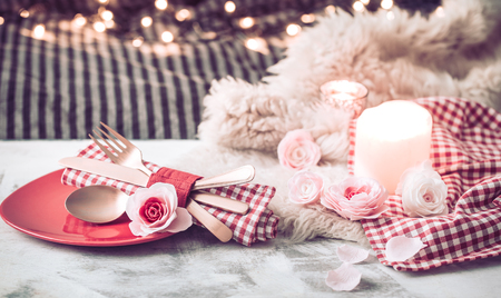 Valentine's Day, festive dinner on a wooden background cutlery in a cozy homely atmosphereの写真素材