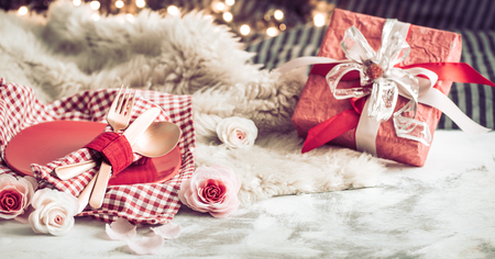 Valentine's Day, a gift on a wooden background in a homely atmosphere, the concept of holiday and friendshipsの写真素材