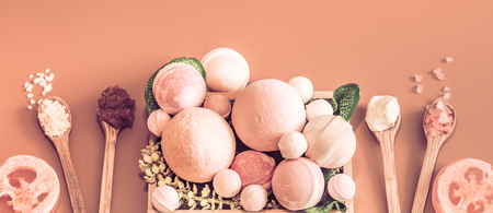 Various Spa items in a wooden spoon and a wooden box for body care on colored background, the concept of beauty and body careの写真素材
