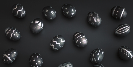 Easter eggs black and white pattern, handmade , isolated on black background, the concept of the Easter holidaysの写真素材