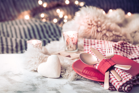 Valentine's Day, festive dinner on a wooden background cutlery in a cozy homely atmosphereの写真素材