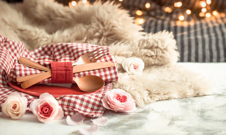 Valentine's Day, festive dinner on a wooden background cutlery in a cozy homely atmosphereの写真素材