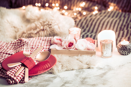 Valentine's Day, festive dinner on a wooden background cutlery in a cozy homely atmosphereの写真素材