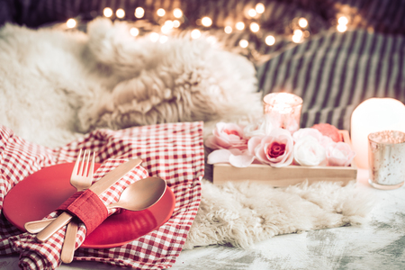 Valentine's Day, festive dinner on a wooden background cutlery in a cozy homely atmosphereの写真素材