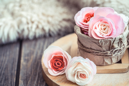 Valentine's day concept, roses of different colors in a box on a wooden backgroundの写真素材