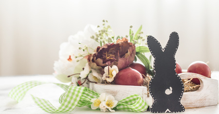 Easter background with Bunny and Easter basket , bright interior, the concept of the Easter holidaysの写真素材