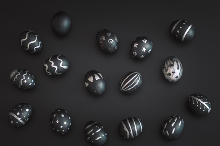 Easter eggs black and white pattern, handmade , isolated on black background, the concept of the Easter holidaysの写真素材