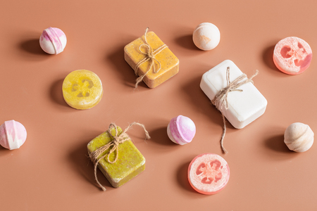 Flat composition with cosmetic products on a colored background. Soap, bath bomb. View from the top banner. Place for textの写真素材