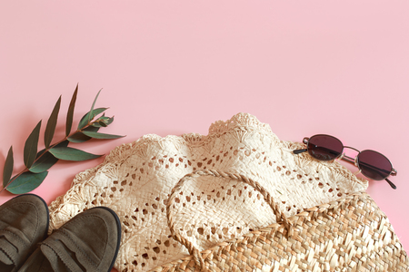 Spring Accessories and Clothes on a pink background, space for text.の写真素材