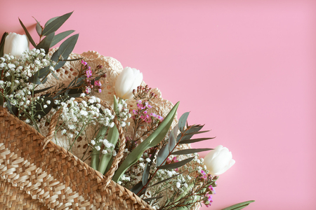 spring flower arrangement with white tulips on a pink background, space for textの写真素材