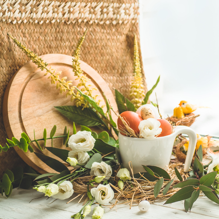 Happy Easter background. Easter egg in a nest with floral decoration near the window. Quail eggs. Happy Easter concept.の写真素材
