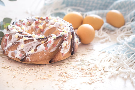 Composition with Easter sweet cake and eggs with flowers on a light background, the concept of the...
