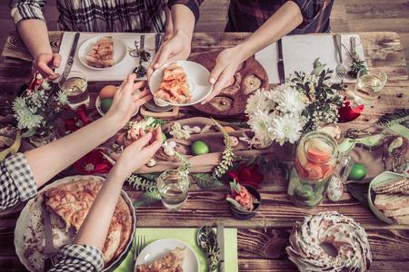Home Celebration of friends or family at the festive Easter table with Easter cake, top view, celebration Conceptの写真素材