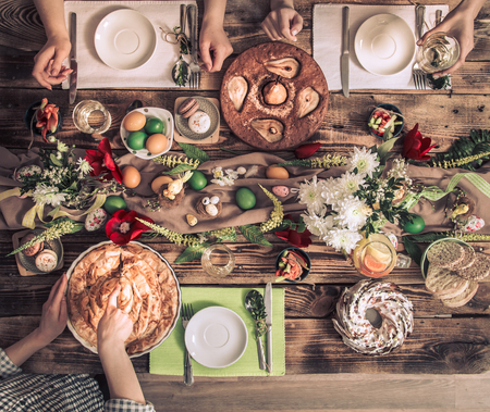 Home Celebration of friends or family at the festive Easter table with Easter cake, top view, celebration Conceptの写真素材