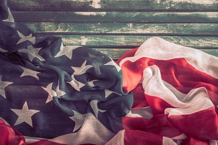 National Patriotic symbols. American flag on an old wooden background.The concept of patriotism and celebrationの写真素材
