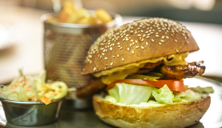 Fast food, french fries with a sandwich in a cafe, fast food conceptの写真素材