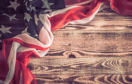 National Patriotic symbols. American flag on an old wooden background.The concept of patriotism and celebrationの写真素材