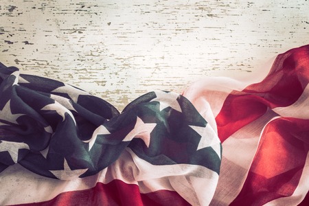 National Patriotic symbols. American flag on old white wooden background.The concept of patriotism and celebrationの写真素材