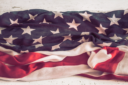National Patriotic symbols. American flag on old white wooden background.The concept of patriotism and celebrationの写真素材