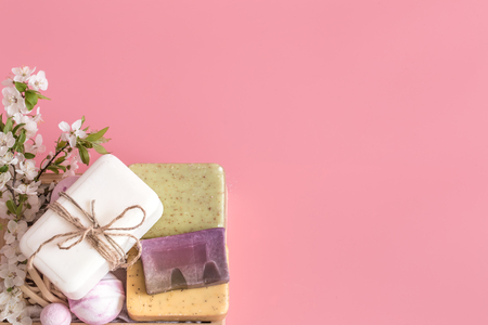 Spring Spa still life on an isolated pink background with spring flowers and organic body care productsの写真素材