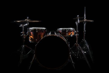Drum Set On A Stage At Dark Background. Musical Drums Kit On Stage. Vintage look with smoke effectの写真素材