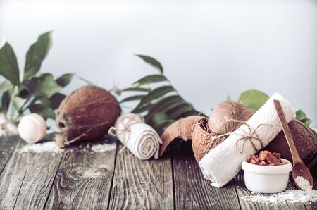 Spa and wellness setting with flowers and towels. Bright composition with tropical flowers. Dayspa nature products. Wooden spoonの写真素材