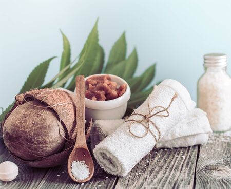 Spa and wellness setting with flowers and towels. Bright composition with tropical flowers. Dayspa nature products. Wooden spoonの写真素材
