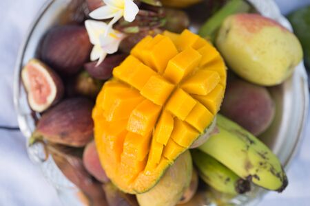 A plate of assorted fruits, sliced mango. The view from the top .の写真素材