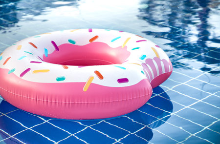 Inflatable accessories for swimming in the pool . In the form of inflatable large pink doughnut. The...