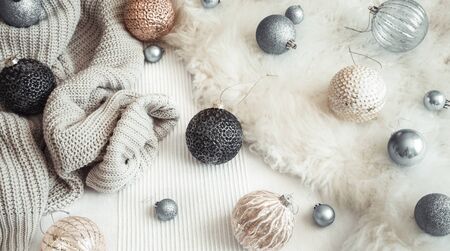 New year and Christmas holiday still Life with decorative toys and knitted sweater . The view from the top. concept of winter holidaysの写真素材