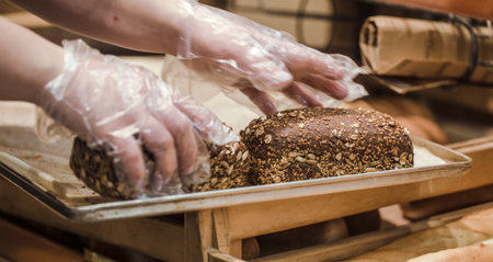 Fresh bread on the counter in the store, close-up . Healthy food and organic products.