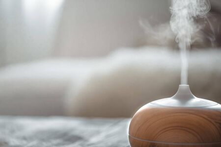Humidifier on the table in the living room. Ultrasonic technology, increase the humidity in the room, comfortable living conditions.の写真素材