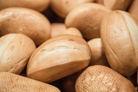 Fresh bread on the counter in the store, close-up . Healthy food and organic products.の写真素材