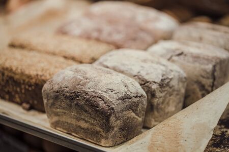 Fresh bread on the counter in the store, close-up . Healthy food and organic products.の写真素材