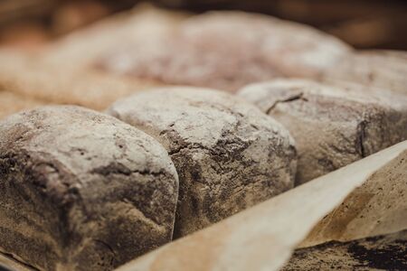 Fresh bread on the counter in the store, close-up . Healthy food and organic products.の写真素材