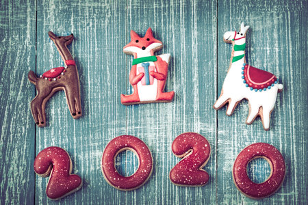 Festive new year gingerbread on a wooden background. The concept of holiday cooking.
