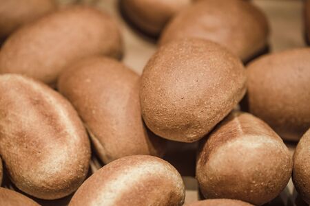Fresh bread on the counter in the store, close-up . Healthy food and organic products.の写真素材