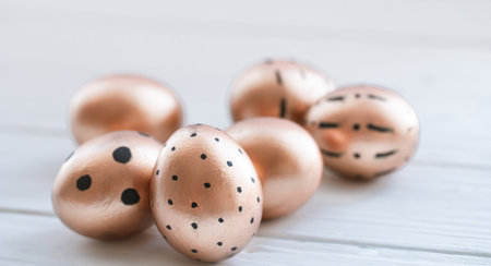 Beautiful decorated Easter eggs of Golden color . The concept of Easter. Holidays and traditions.