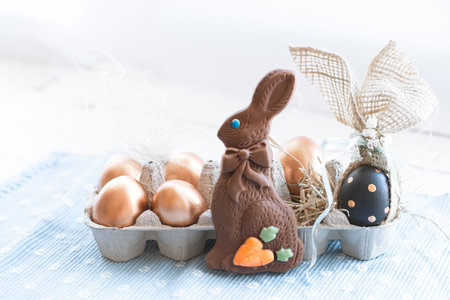 Beautiful decorated Easter eggs with chocolate Bunny. The concept of Easter. Holidays and...
