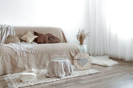 The interior of the living room with a sofa and decorative items . The concept of a cozy home.の写真素材