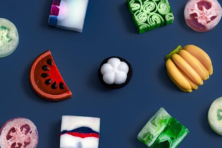 Bright handmade soap in the form of fruit on a blue background . The concept of objects. Trend color.の写真素材
