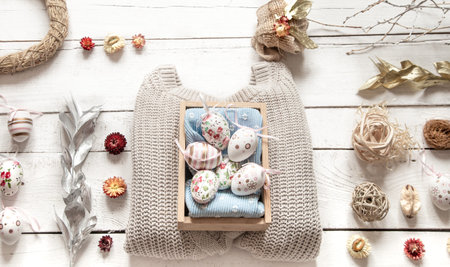 Easter stylish still life on a wooden background, with Easter decor . The concept of the Easter...