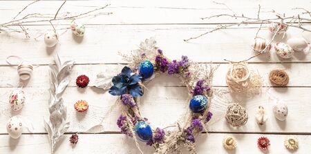 Stylish composition with an Easter wreath and eggs trend blue. The concept of Easter decorations and celebration.の写真素材